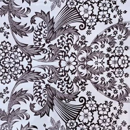 Black and white floral and leaf pattern on a textured fabric background