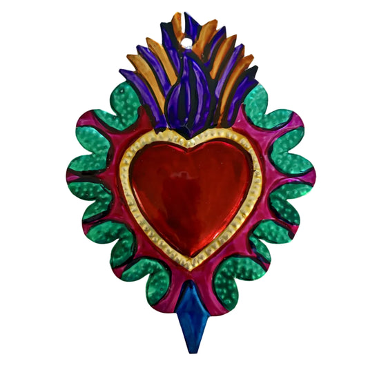A colorful decorative heart-shaped wall hanging or ornament with a glossy red heart center, gold border, green scalloped outer shape, purple and blue lower section, and purple, blue, and gold flame-like tops, shown on a plain light background.