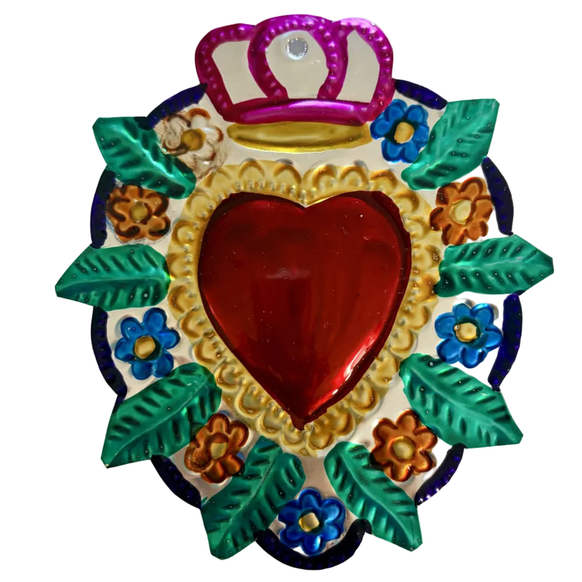 A colorful Mexican-style metal heart ornament featuring a red heart in the center, surrounded by a gold scalloped border, green leaves, blue and orange flowers, and a pink crown at the top, displayed on a plain white background.