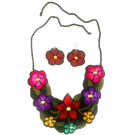 Floral necklace and earrings set on a white background