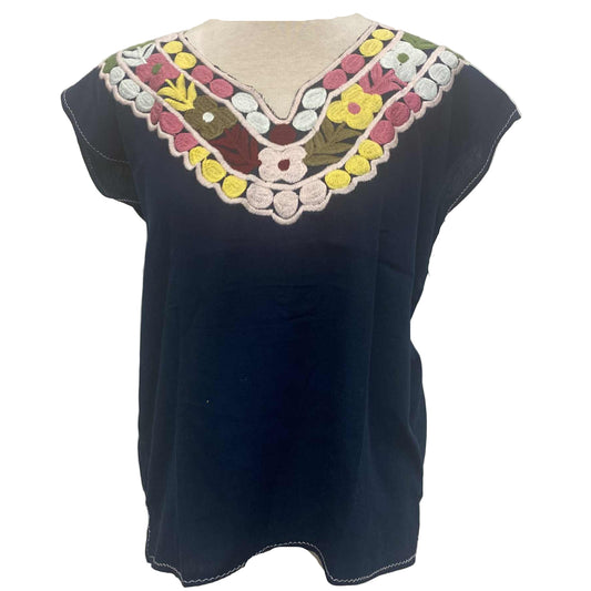 Navy blue top with colorful floral embroidery on a mannequin against a white background